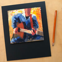 This image shows how the art is mounted on mat board. The pencil demonstrates relative size.